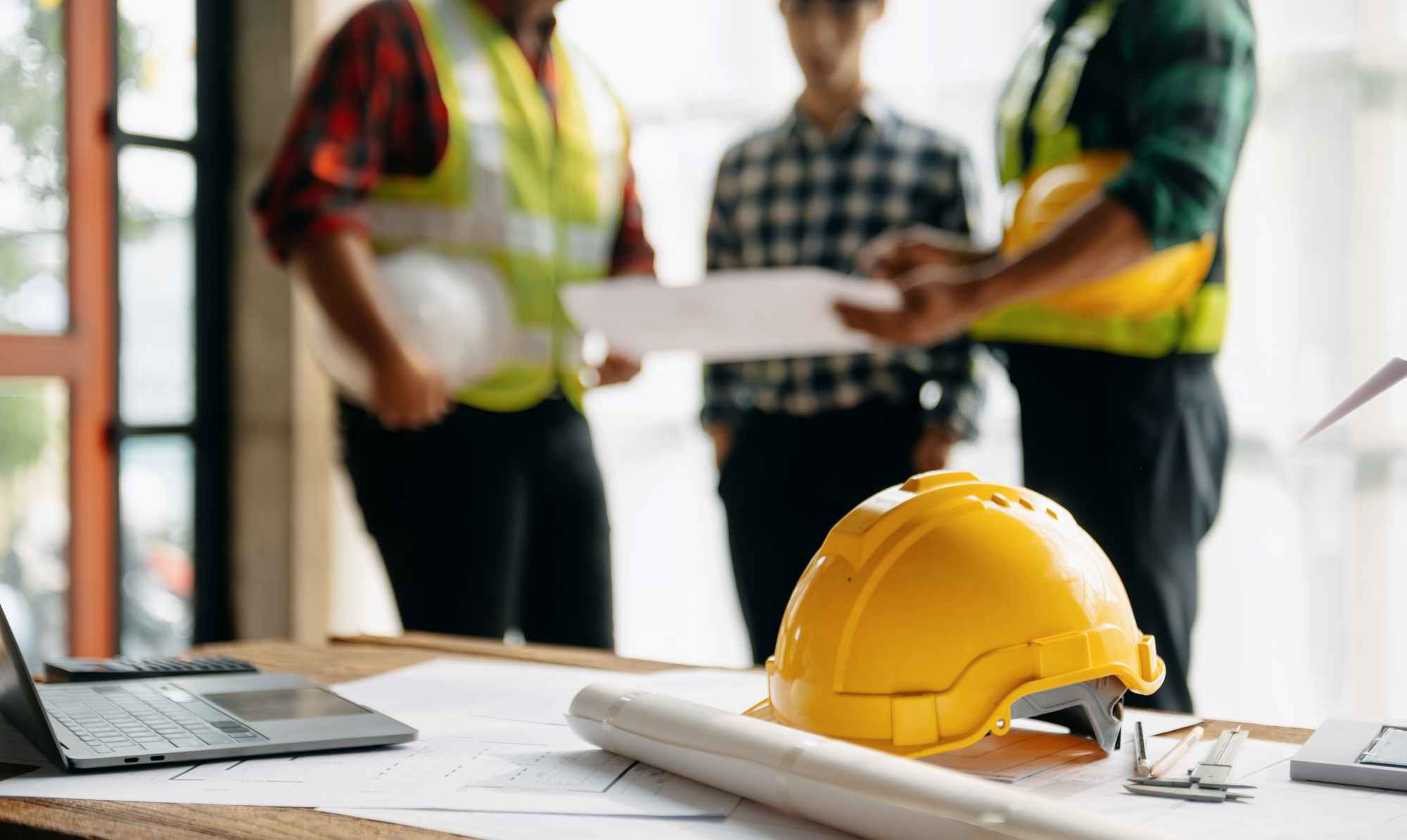 Technical services planning with safety equipment and project drawings